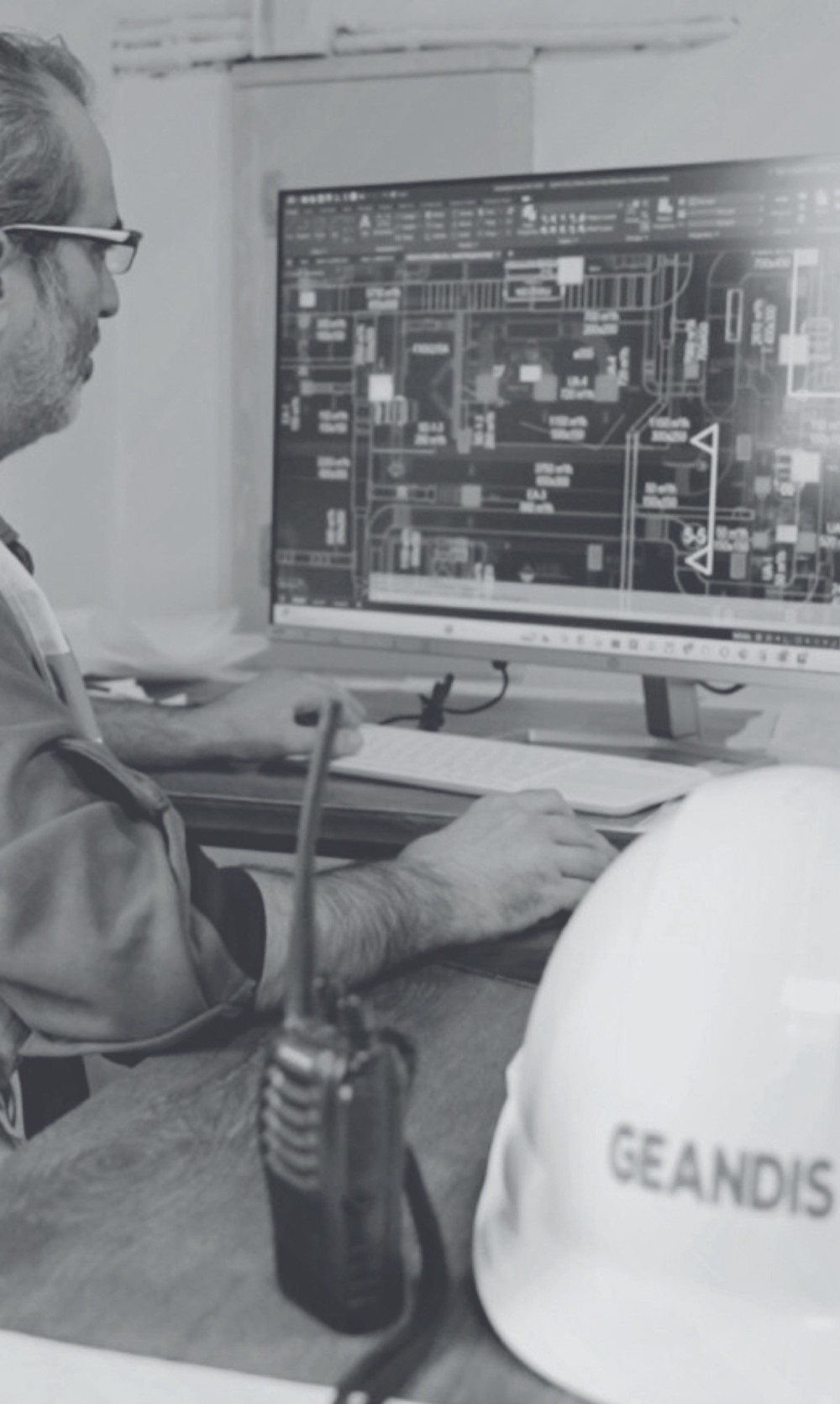 GEANDIS engineer reviewing technical drawings