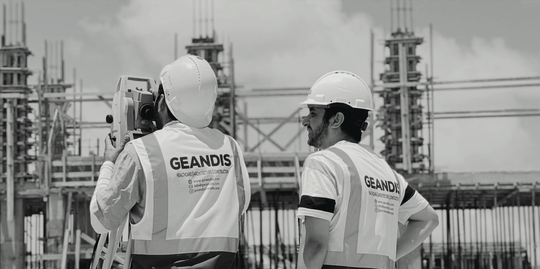 GEANDIS engineers surveying a construction site